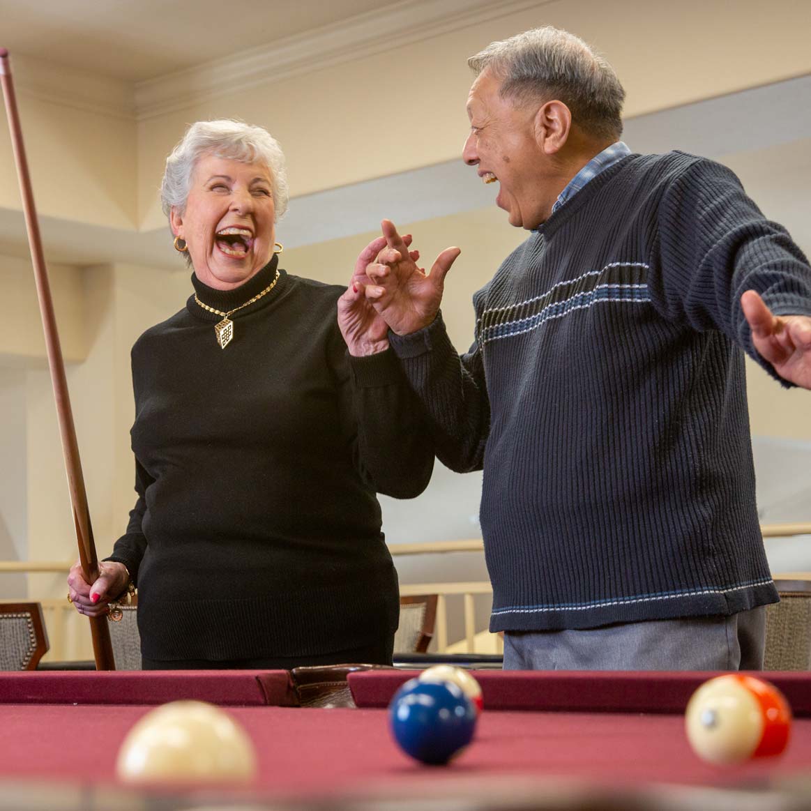 Residents playing billiards at Heatherwood